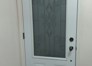 closed white door with a glass design