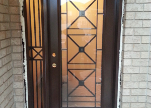 front walkway of a door with a glass design and sidelite