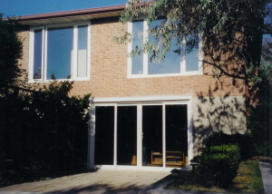 sliding patio doors with 2 white windows above